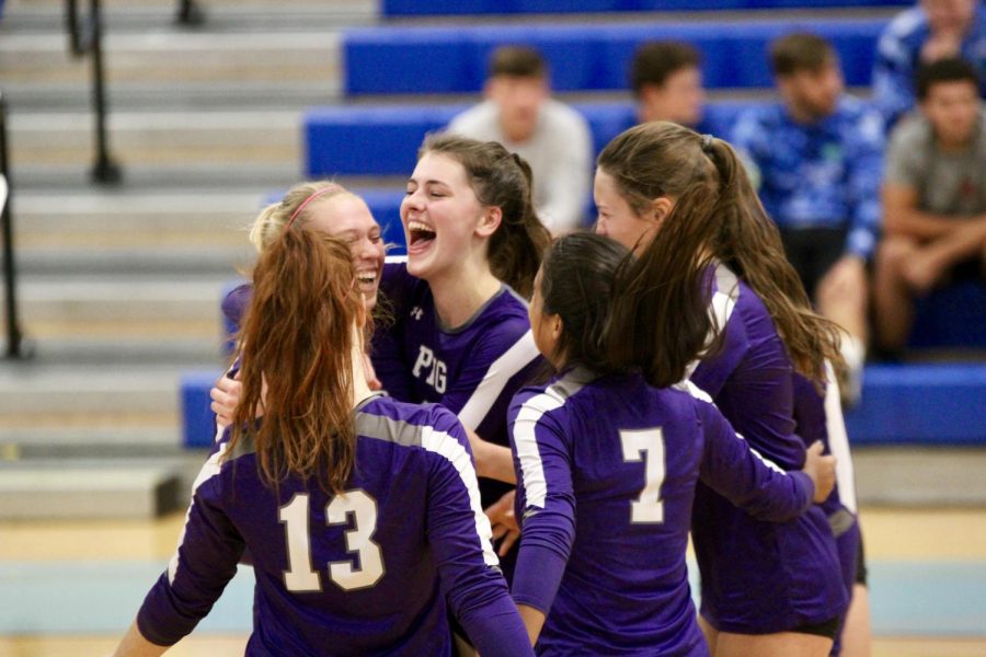 Seniors Kaitlyn Gil, center, and 
Maylin Lourvier, left, embrace as the rest of the Rock-A-Noos join in after defeating Crosby in the bidistrict round of the Class 5A playoffs in Pasadena.