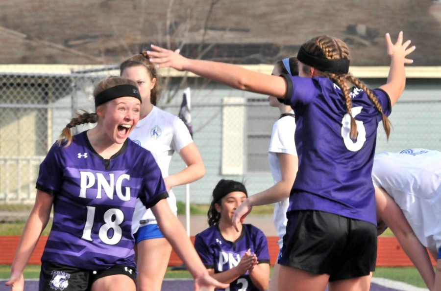 Port Neches-Groves’ Breanna Riggs, left, and Zoe Scroggs  celebrate after Scroggs scores during the second half of Thursday’s match at Indian Stadium. Scroggs’ goal put the Indians up, 2-1, in the match — moments after Riggs scored to the tie the match at 1-1.
