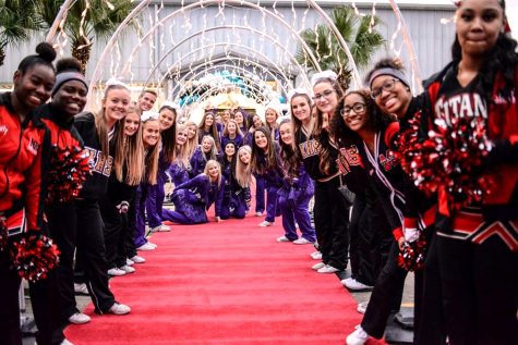 Cheer teams from PN-G, Nederland and Memorial high schools line the entrance to last years Night To Shine prom, presented by the Tim Tebow Foundation.