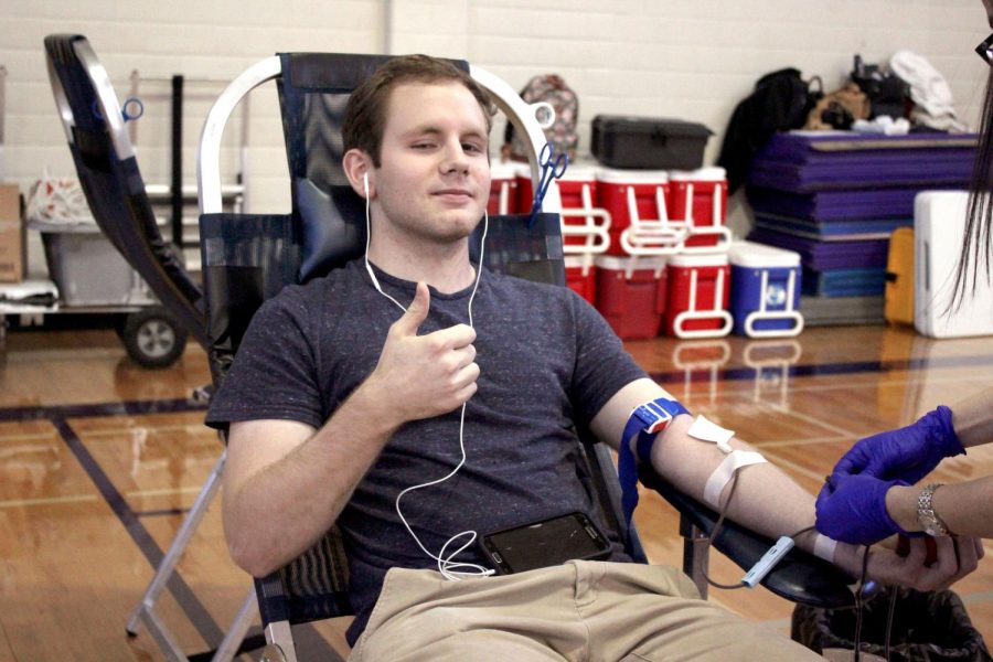 Graduate+Mason+Beard+sits+for+annual+NHS+blood+drive+last+year+in+the+girls+gym.+This+years+blood+drive+will+be+held+Tuesday%2C+Jan.+21.