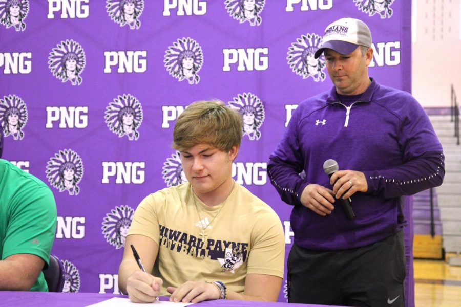 Port Neches-Groves football player Caison Denzlinger signs with Howard Payne University  during Wednesday afternoons college signing ceremony in Port Neches.