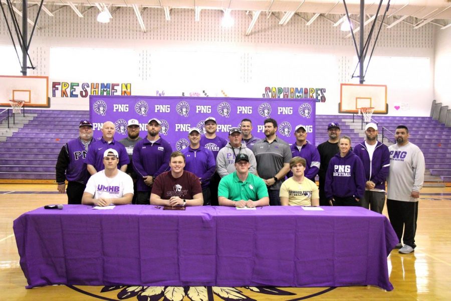 Port Neches-Groves football players, from left, Joshua Patteson, Trey Lisauckis, Jarrett Caillier and Caison Denzlinger sit in front of their coaches before the start of Wednesday afternoons college signing ceremony in Port Neches.