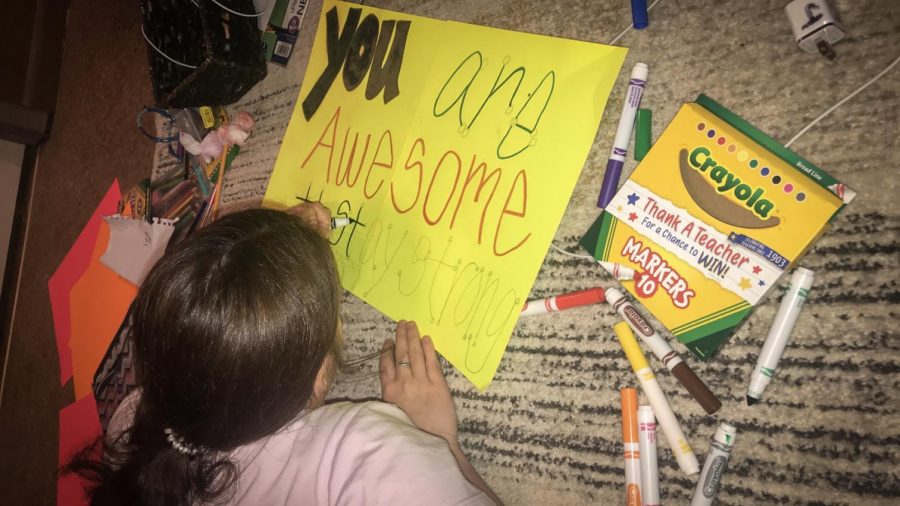 Groves Middle School 8th grader Brooklyn Jackson works on a ‘positivity poster’ activity for teacher Mrs. Kelsey Thibodeaux. 