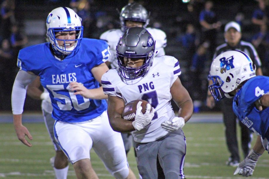 Running back Lance Vaughn, senior, carries the ball through the Barbers Hill defense as the Indians rumble toward the end zone in the second quarter of their game on Friday, Nov. 6 at Eagle Stadium in Mont Belvieu. 
