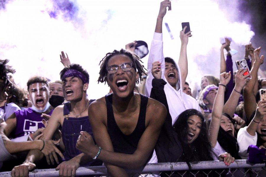 The student section erupts and the baby powder flies as the Indians score the go-ahead touchdown in the final seconds of the fourth quarter during the annual Mid-County Madness rivalry football game with the Nederland Bulldogs on Friday, Oct. 23 at Bulldog Stadium in Nederland.