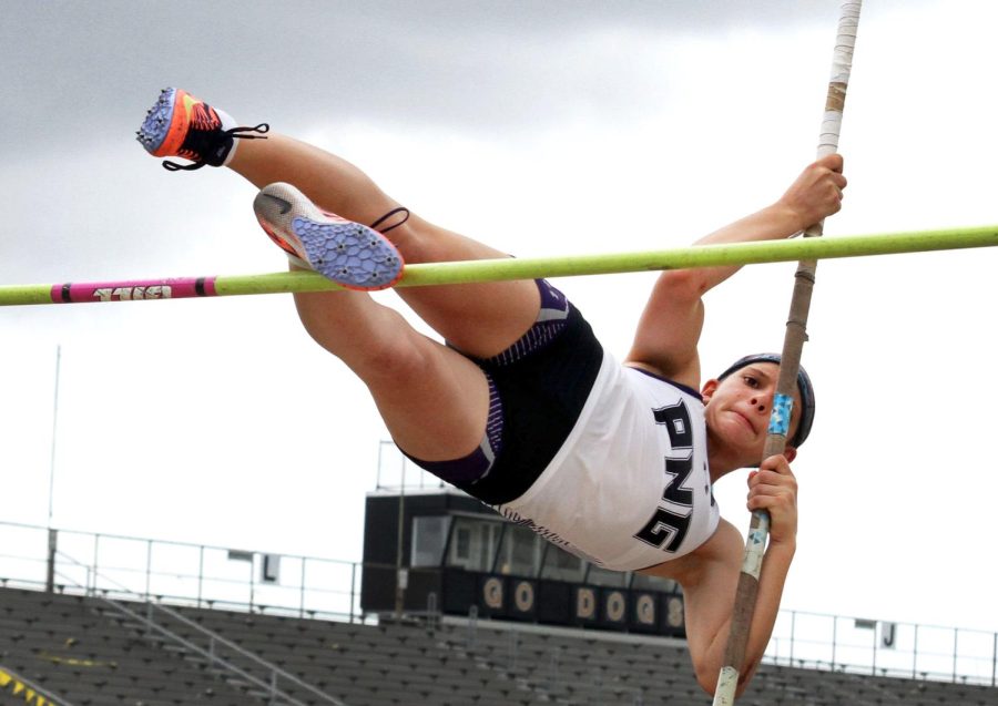Katherine Page, freshman, vaults over the bar at the Nederland Bulldog Relays on Feb. 19, 2021. (Emily Smith/NDN Press)