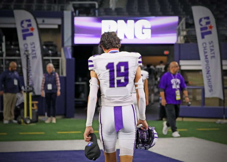 After receiving their UIL state runner-up medals and hats, quarterback Shea Adams (24) trails behind as the last player off the field while the teams heads to the locker room on Friday, Dec. 16 at AT&T Stadium in Arlington. PNG fell to South Oak Cliff, 24-34, in the Class 5A title game — its first appearance in the championship game since 1999. (Emily Mire/NDN Press)