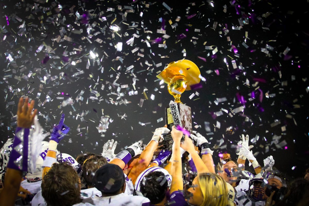 As a deluge of purple and white confetti rains down on them, the varsity football team hoists the Bum Phillips Trophy over its heads following its 41-16 victory in the annual Mid-County Madness rivalry football game with Nederland on Friday, Oct. 27 at Bulldog Stadium in Nederland. 

The Bum Phillips trophy was christened in the 2013 matchup between the two teams on Friday, Oct. 18. The elder Phillips tragically passed away that evening as the teams battled for the trophy for the first time.

Bum Phillips coached both teams in shorts stints during the 1950s and 60s, his last stint being with PNG, where he coached as son, Wade, played. 

The Bum Phillips Trophy was designed to acknowledge the NFL coaching legends signature cowboy hat. (Jordan Ochoa/NDN Press)