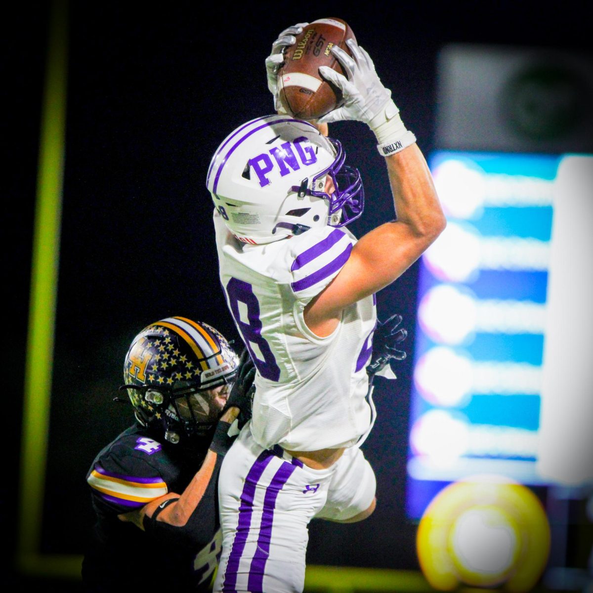Sailing toward the sideline, varsity wide receiver Reid Richard grips a pass from quarterback Conner Bailey (26) midway through the third quarter of the teams Class 5A state semifinal game with Liberty Hill on Friday, Dec. 8 at the Berry Center in Cypress. 

Though he caught the pass, Richard landed out of bounds and the pass was ruled incomplete. 

PNG stayed ahead of Liberty HIll through the remainder of the game and won, 42-35, to advance to the state championship game for the second year in a row. (Celia Ruiz/NDN Press)