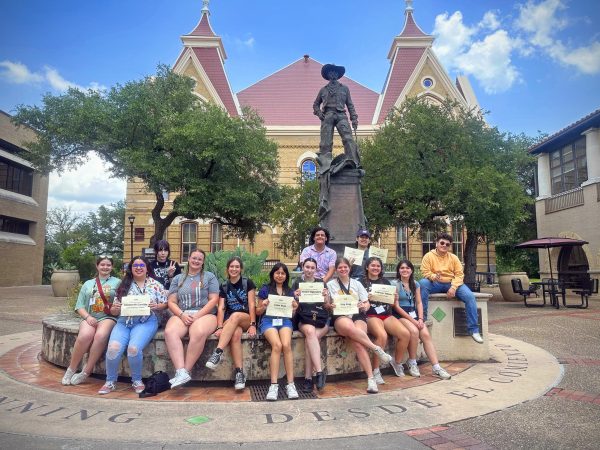 NDN Press photographers sit outside the Old Main Building on the campus of Texas State University following the conclusion of their photography track at the ILPC/TAJE Summer Workshop in San Marcos. 