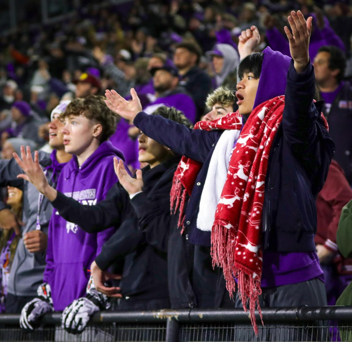 While Texas High ran in for a third-quarter touchdown, Timmy Ta ('25) stretches his arms out as he and others in the front row of the student section question the referees for not calling holding on the play during the Class 5A-II regional round playoff game with Texas High at Northwestern State University in Natchitoches, Louisiana on Friday, Nov. 29, 2024. 
"I can't believe they didn't call it, we all saw it," Ta said. 

The two teams would trade leads the remainder of the game until PNG blocked a game-tying field goal on the last Texas High drive to seal the victory, 31-28. (Izzy Zeig/NDN Press)