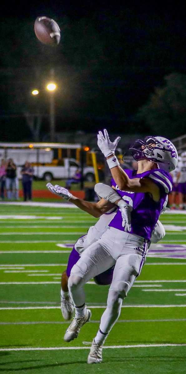 As he reaches out for an incoming pass, wide receiver Seth Brisboe is grabbed by a Dayton defender, resulting in a pass interference call during the regular-season finale on Friday, Nov. 7, 2025. The Indians won, 49-7, to complete its undefeated regular season. (Ella Owens/NDN Press)